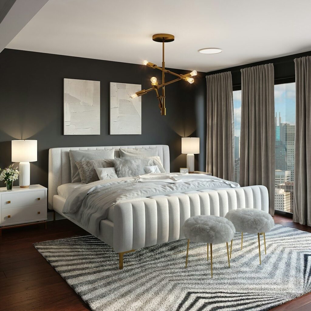 Primary bedroom with a charcoal accent wall and modern chandelier
