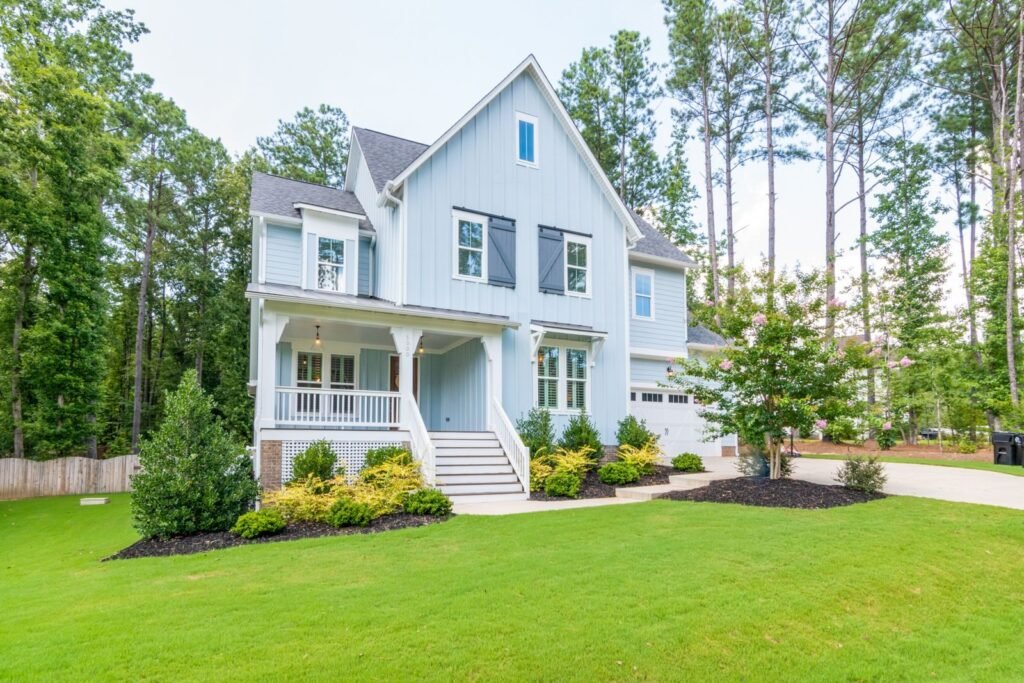 The Cazenovia: side view of the front porch and landscaping