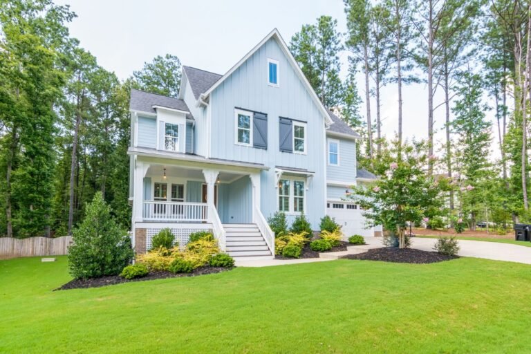 The Cazenovia: side view of the front porch and landscaping