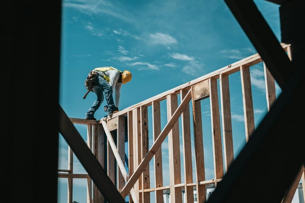 Builder framing an exterior wall on a new home