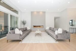 Bright modern living room with a linear gas fireplace and wide-plank oak floors