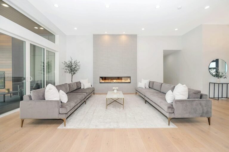 Bright modern living room with a linear gas fireplace and wide-plank oak floors
