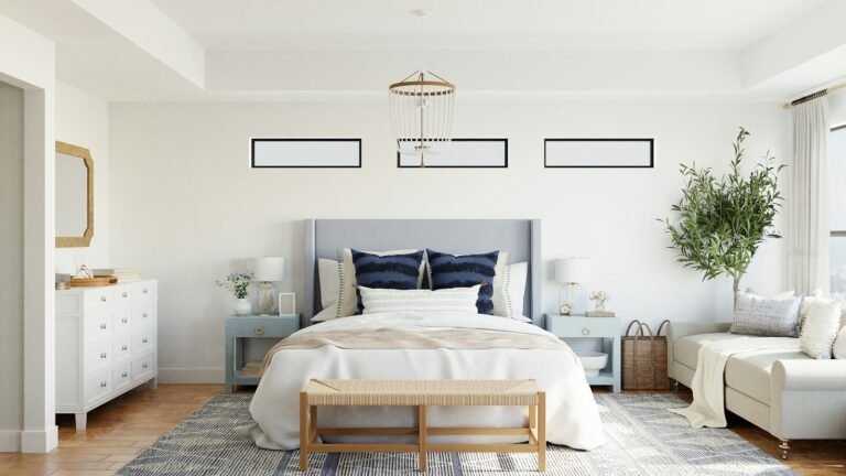 Bright primary bedroom with an upholstered bed and natural light