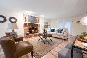 Family room with a fireplace and leather seating