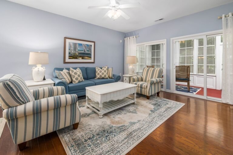 Bright living room with large windows and hardwood floors