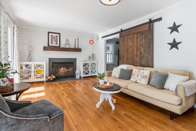 Living room with a brick fireplace and sliding barn door