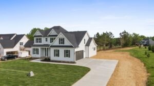 The Summit Ridge: front corner view with the attached garage and driveway