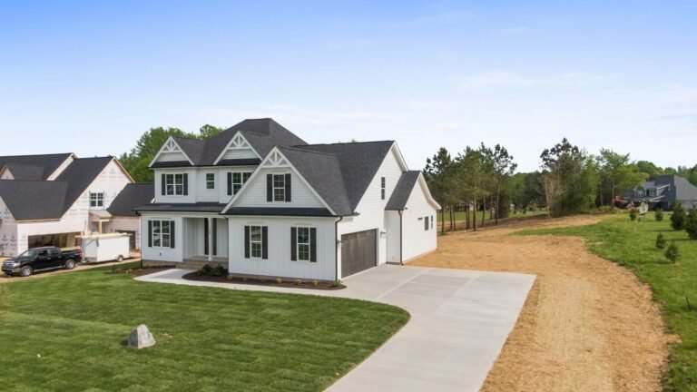 The Summit Ridge: front corner view with the attached garage and driveway